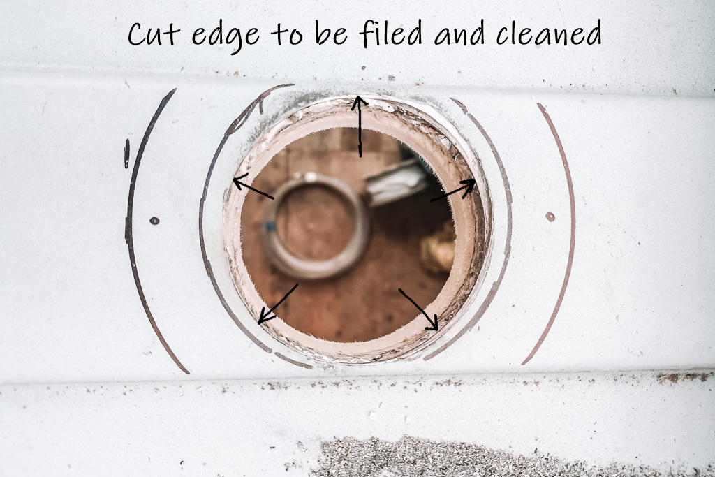 Annotated picture showing which parts of the cut out hole need to be filed and cleaned