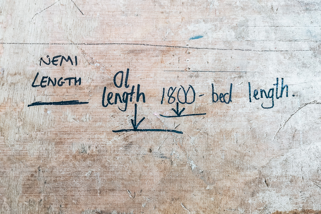 Meausrements written on the floor for the bed in a campervan conversion