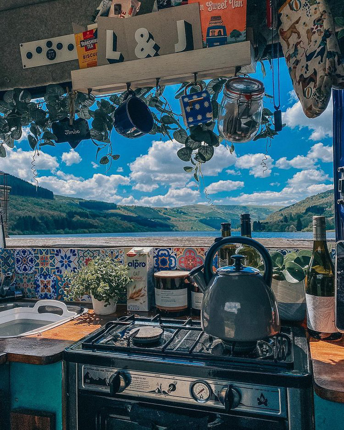 A DIY campervan kitchen with a view out the window