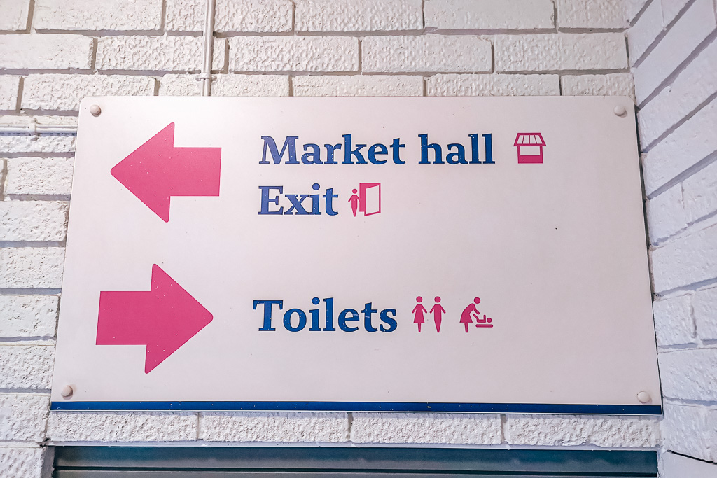 Sign showing directions to the public toilets