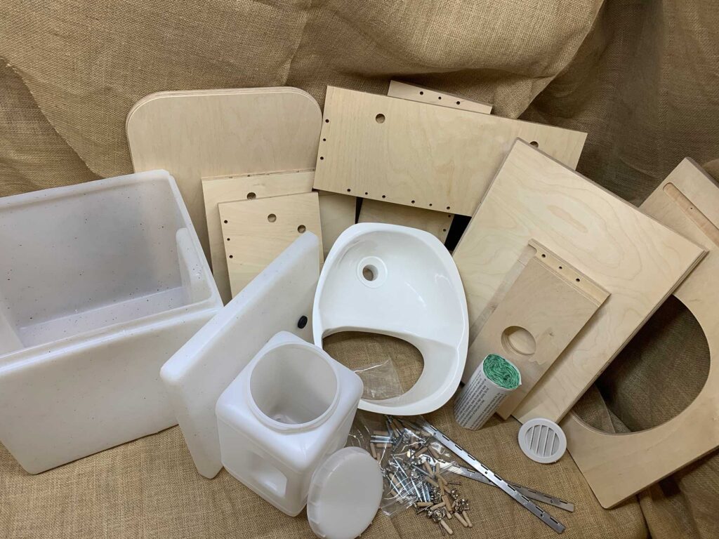 A DIY components kit to make your own "little floozy" composting toilet complete with wooden frame but without a toilet seat