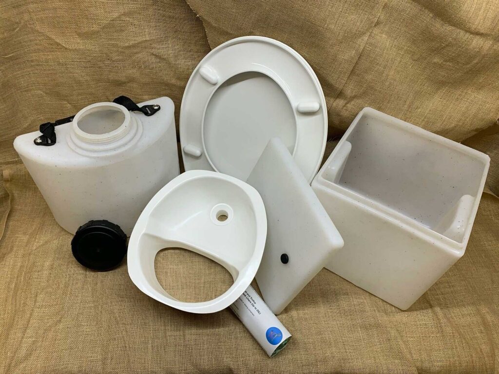 A DIY kit to make a composting loo without the wooden frame but with a white toilet seat
