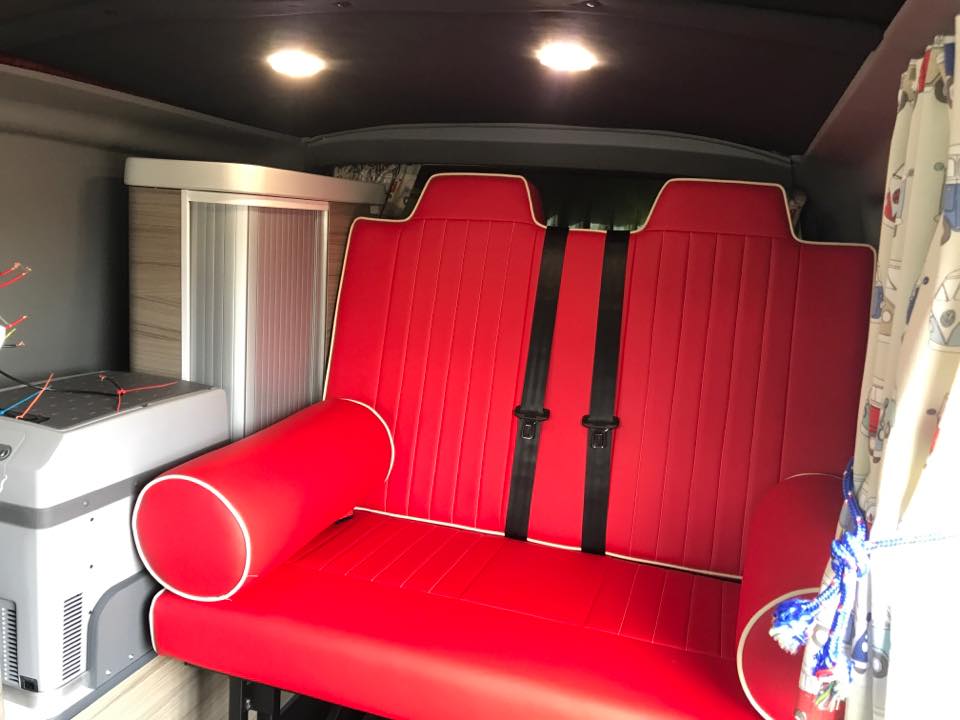 A red vinyl leather rock and roll bed for a campervan